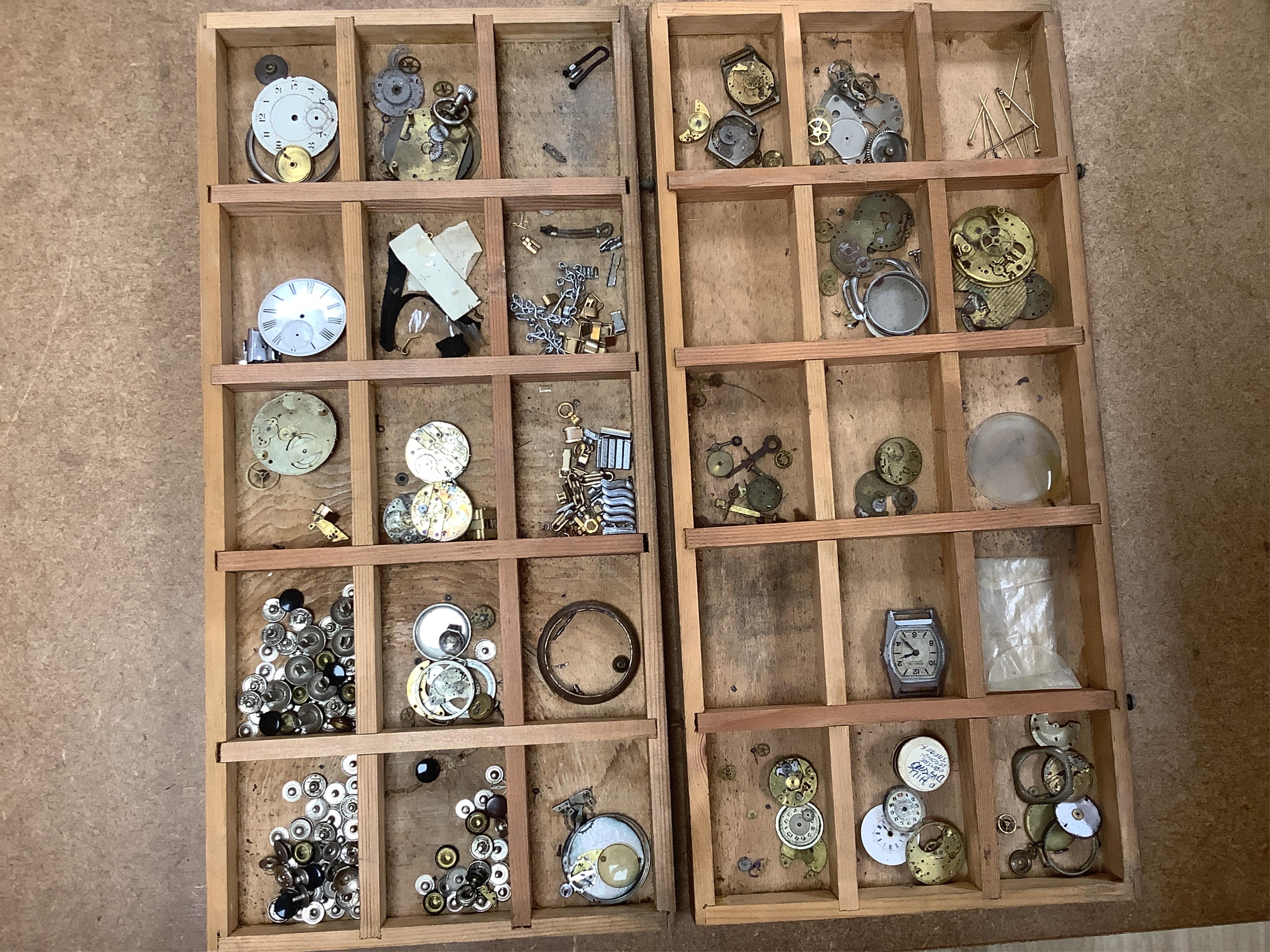 A wooden twelve drawer cabinet containing a collection of watch parts. Condition - cabinet fair to good, watch parts as found